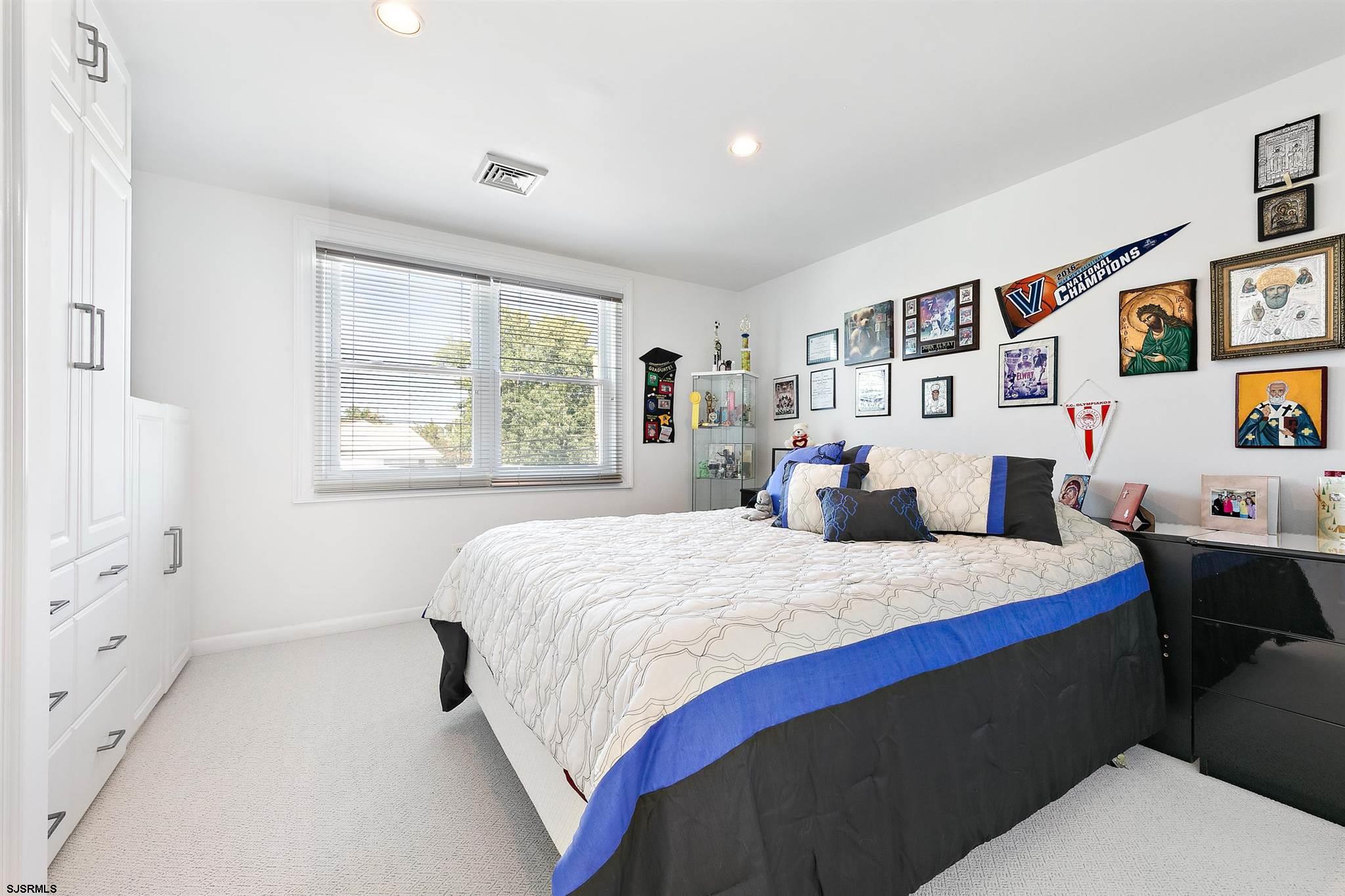 1401 Shore Road Northfield, NJ 08225 - Photo 52 of 96 a bed room with a bed and a tv