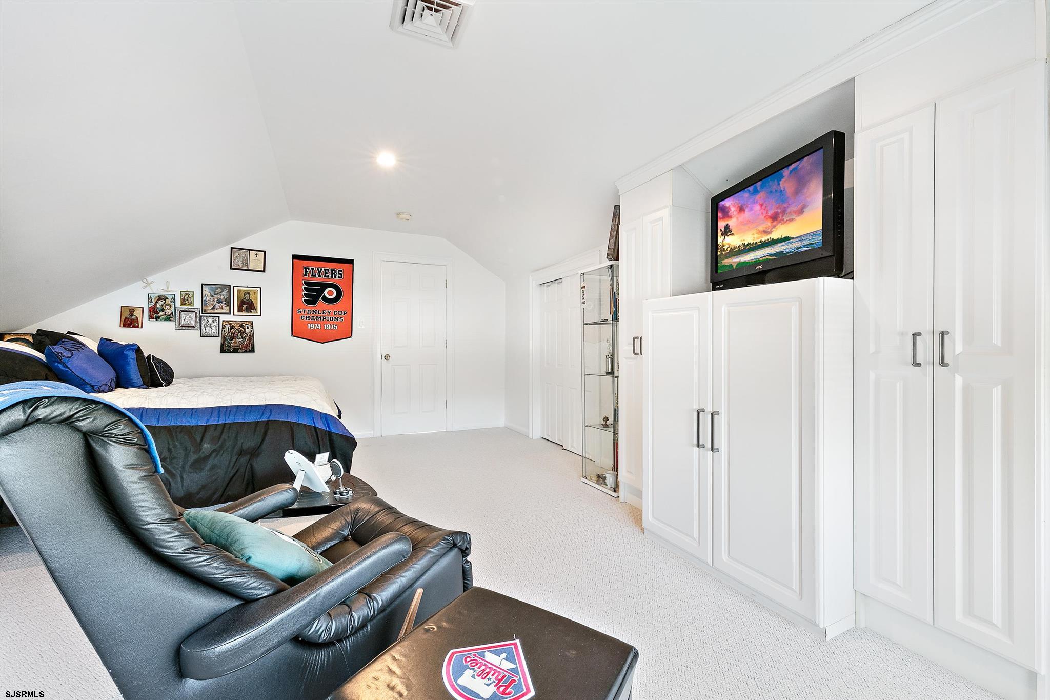 1401 Shore Road Northfield, NJ 08225 - Photo 55 of 96 a living room with furniture and a flat screen tv