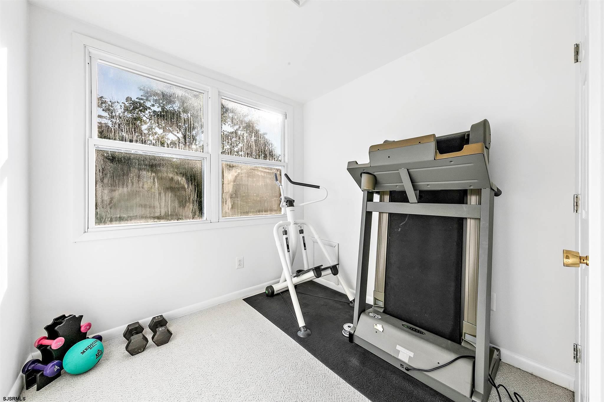 1401 Shore Road Northfield, NJ 08225 - Photo 57 of 96 a room with gym equipment and a window