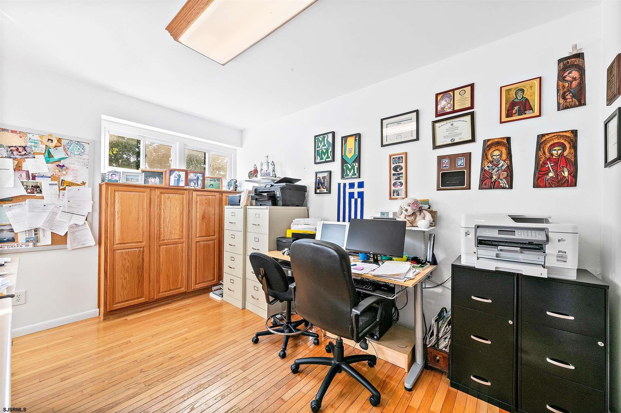 1401 Shore Road Northfield, NJ 08225 - Photo 64 of 96 a workspace with wooden floor and furniture