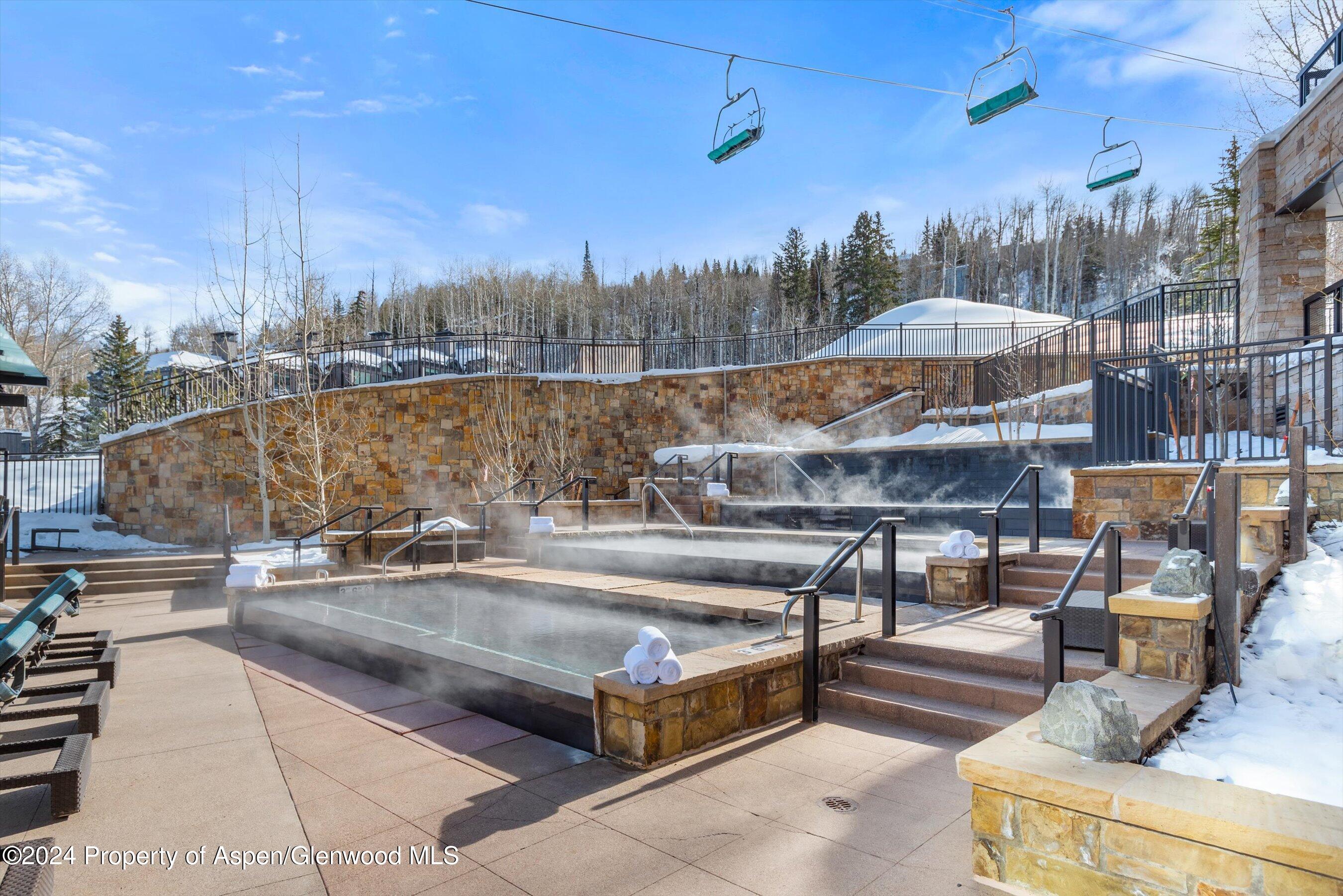 130 Wood Road, Unit 504 Snowmass Village, CO 81615 - Photo 16 of 20 a terrace with outdoor seating and city view