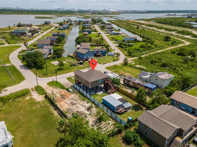 an aerial view of a house with a lake view