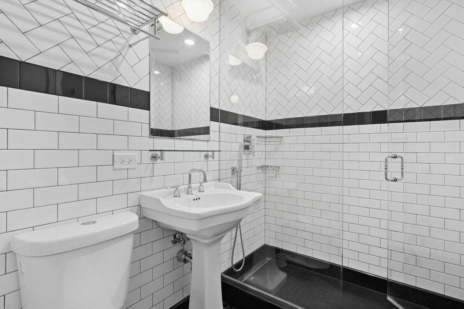 4932 North Ridgeway Avenue, Unit 2 Chicago, IL 60625 - Photo 11 of 21 a bathroom with a sink a toilet and shower