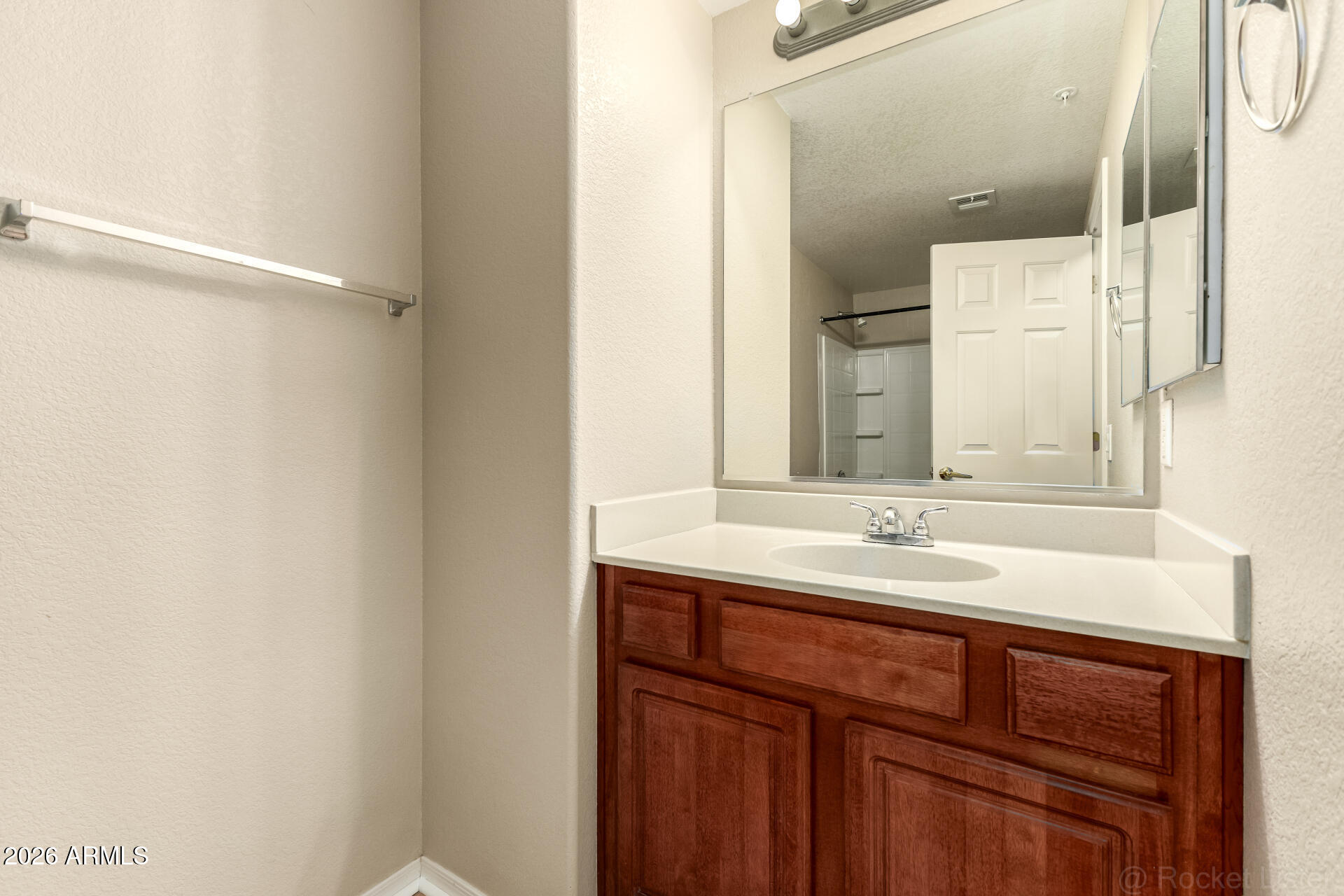 18250 North Cave Creek Road, Unit 198 Phoenix, AZ 85032 - Photo 17 of 30 a bathroom with a sink and a mirror