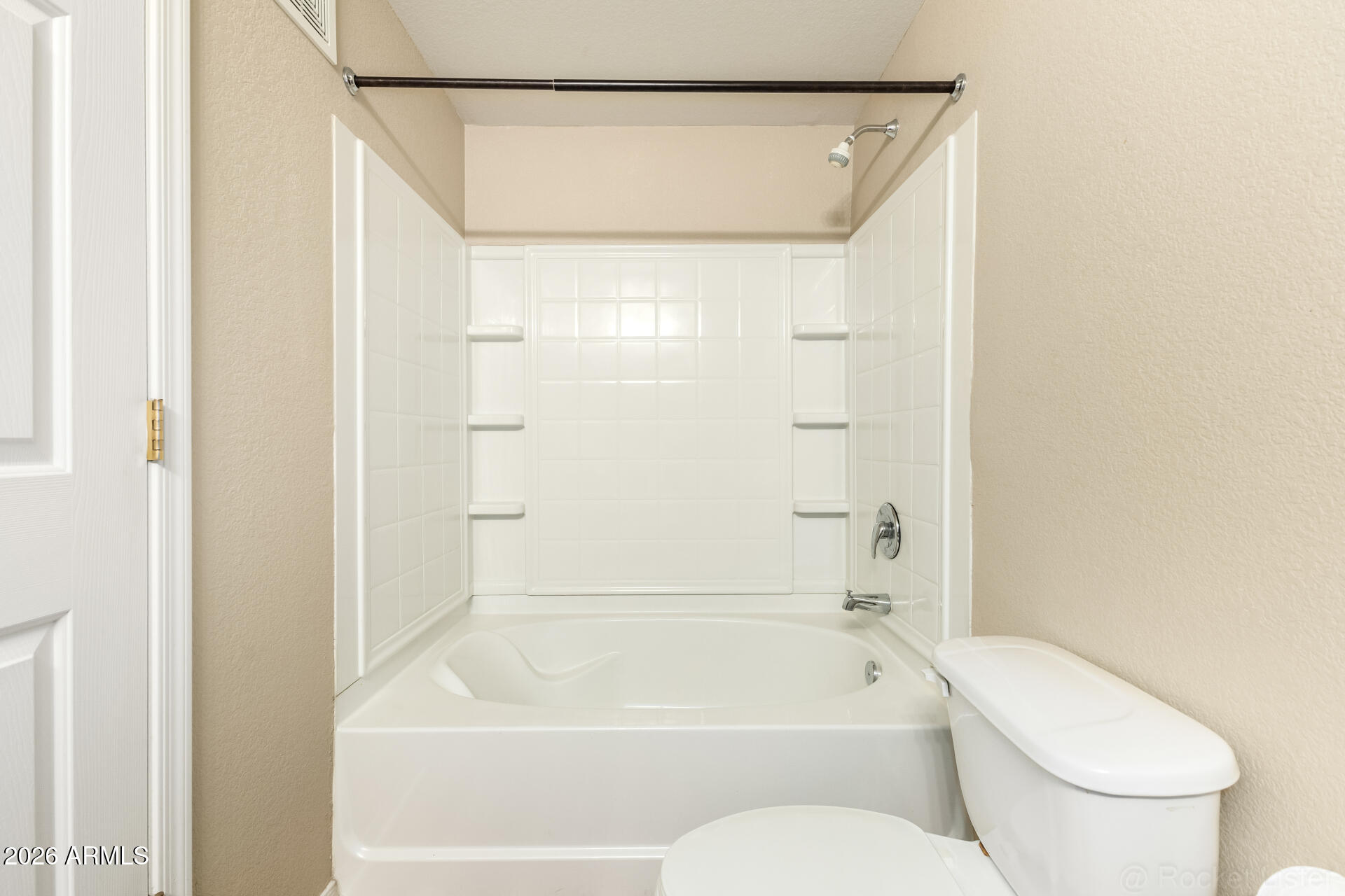 18250 North Cave Creek Road, Unit 198 Phoenix, AZ 85032 - Photo 18 of 30 a bathroom with a toilet and a bathtub
