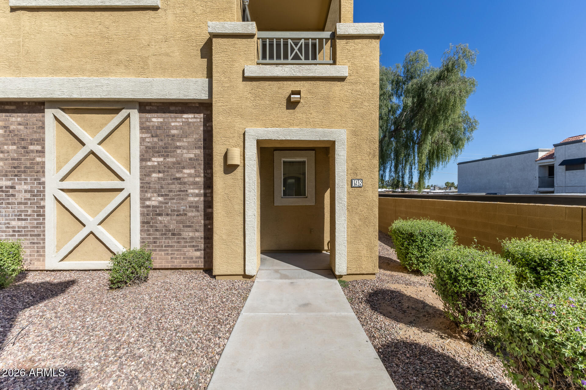 18250 North Cave Creek Road, Unit 198 Phoenix, AZ 85032 - Photo 20 of 30 a front view of a house with garden