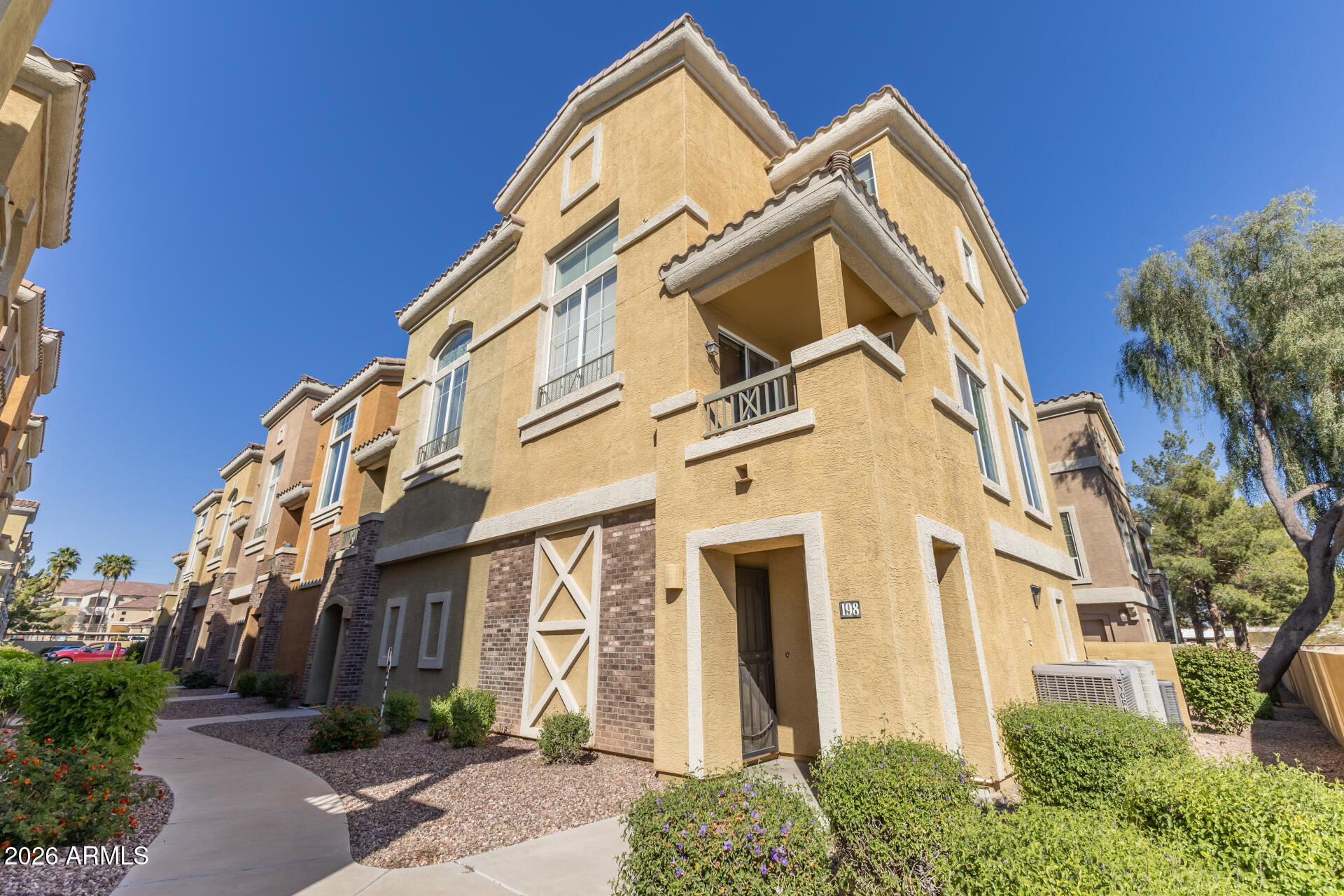 18250 North Cave Creek Road, Unit 198 Phoenix, AZ 85032 - Photo 22 of 30 a view of a white building among the street