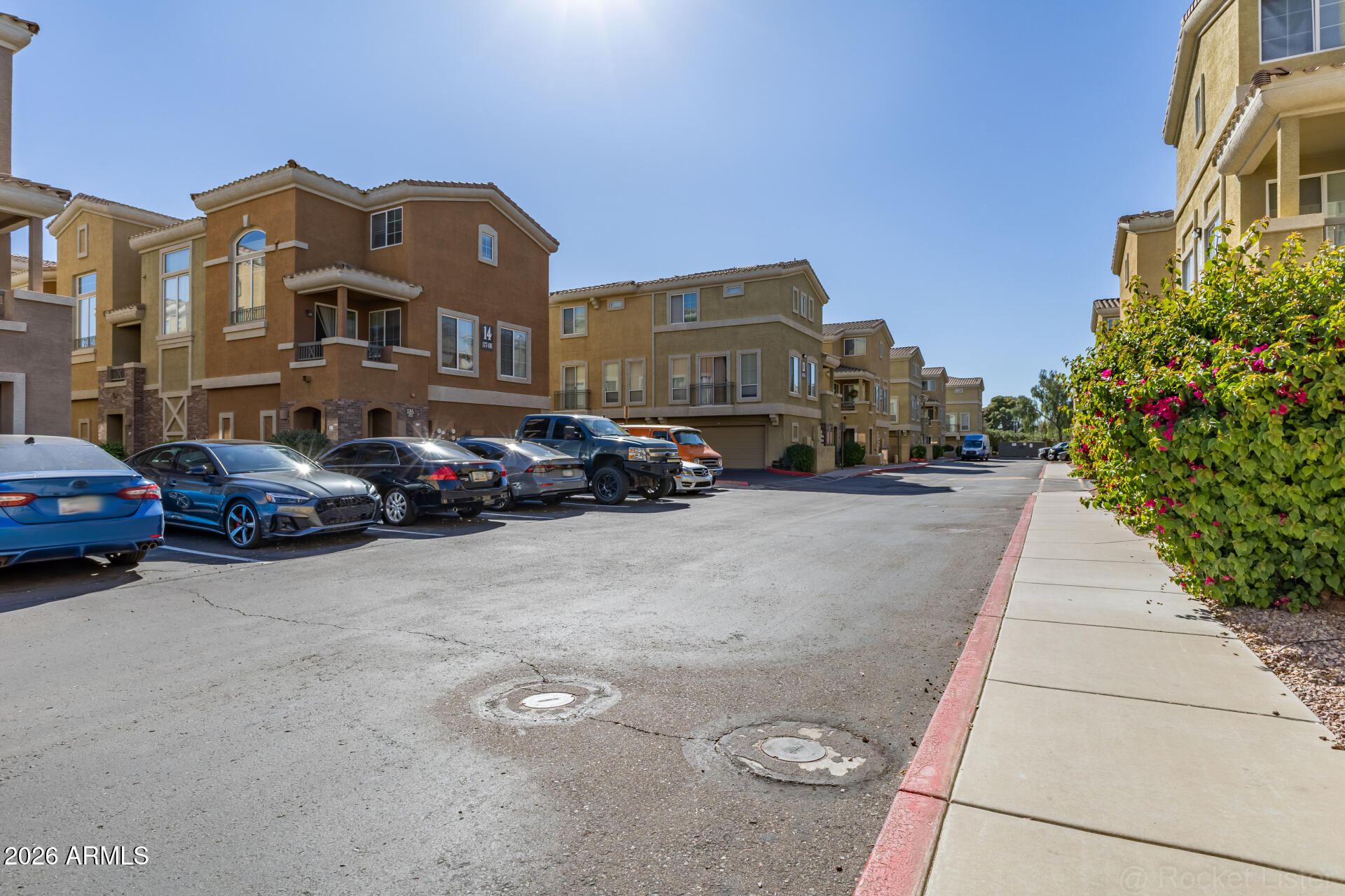 18250 North Cave Creek Road, Unit 198 Phoenix, AZ 85032 - Photo 29 of 30 a couple of cars parked in front of a building