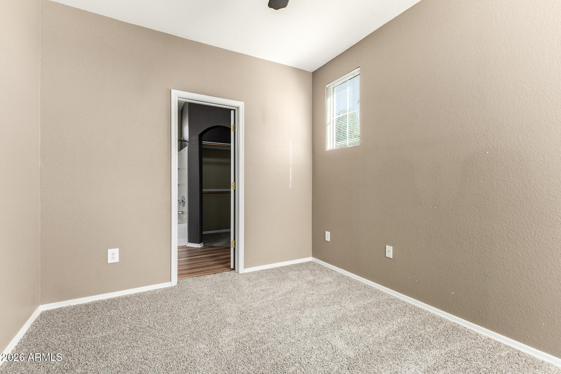 18250 North Cave Creek Road, Unit 198 Phoenix, AZ 85032 - Photo 10 of 30 an empty room with windows and closet
