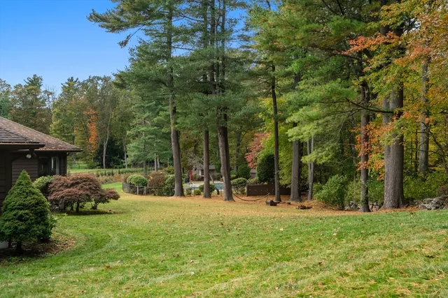 a backyard of a house with lots of green space