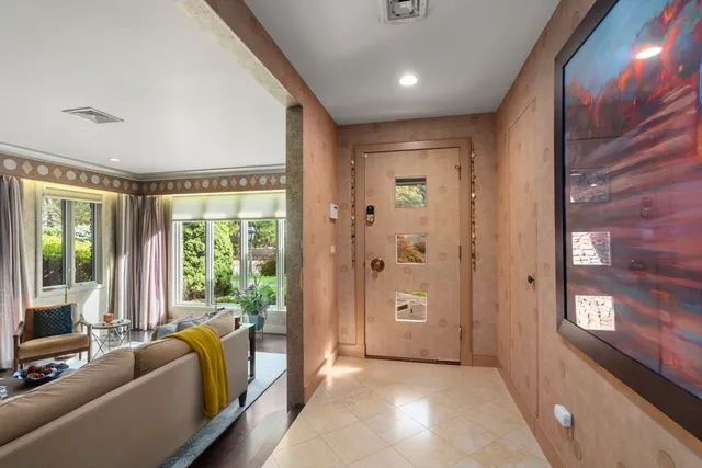 a view of a livingroom with furniture and a large window