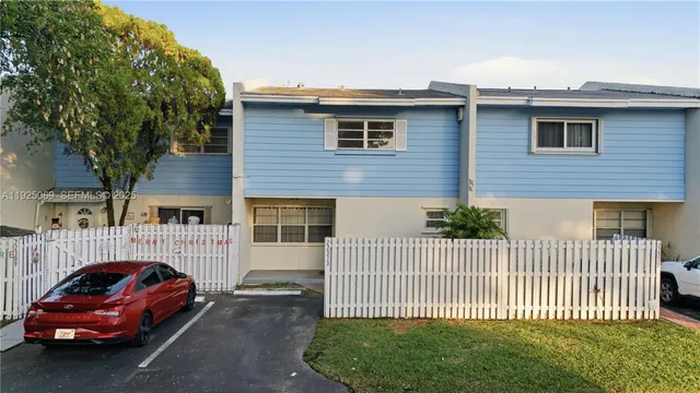 a car parked in front of a house