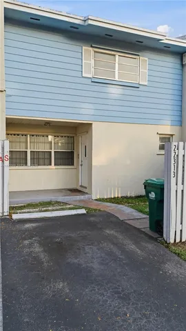 a view of a house with a garden