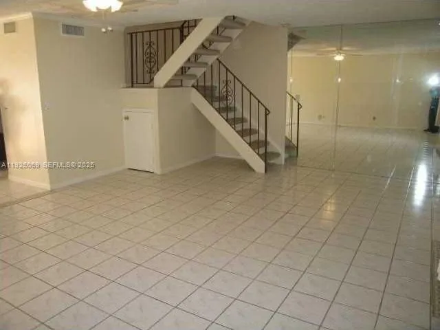 a view of entryway and hall with a window