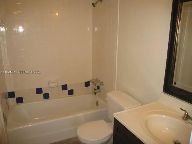 a bathroom with a sink a toilet and bathtub