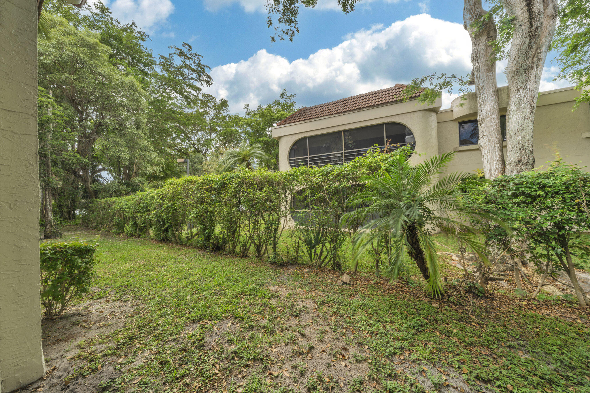 22136 Palms Way, Unit 103 Boca Raton, FL 33433 - Photo 13 of 42 a view of a house with a yard