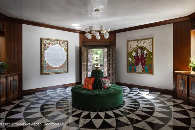 a couple of blue couches sitting next to a window