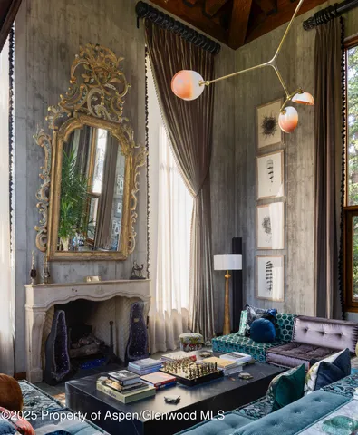 a view of a livingroom with furniture and a fireplace