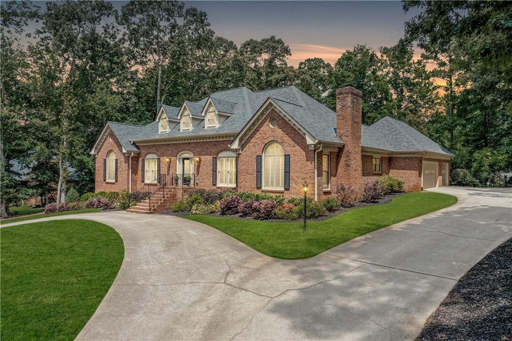 2065 Innsfail Drive Snellville, GA 30078 - Photo 1 of 67 a front view of a house with a garden