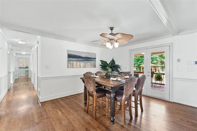 a view of a dining room with furniture window and wooden floor