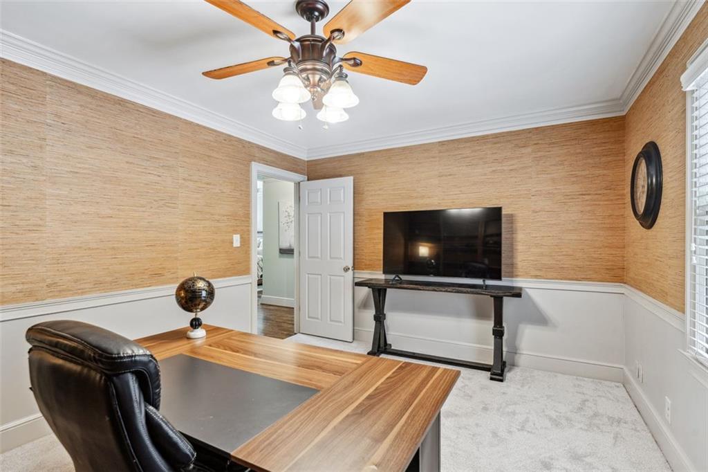 2065 Innsfail Drive Snellville, GA 30078 - Photo 25 of 71 a view of a livingroom with furniture and a flat screen tv