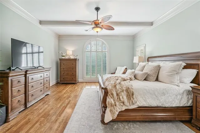 a white toilet sitting next to a bathroom sink and a shower curtain