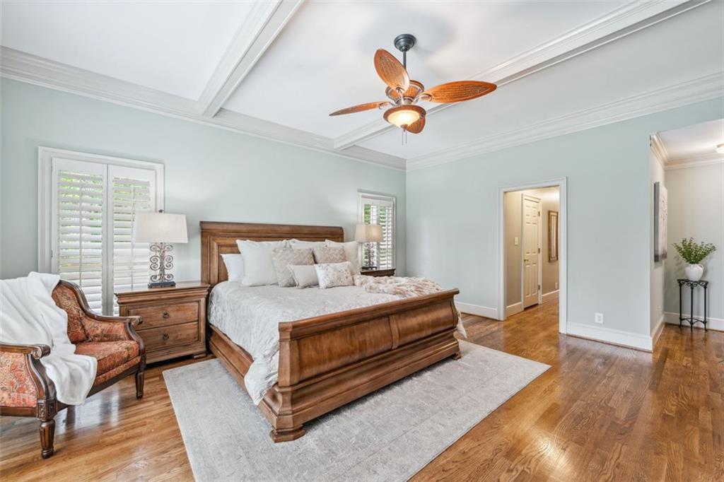 2065 Innsfail Drive Snellville, GA 30078 - Photo 27 of 71 a spacious bedroom with a bed a chandelier and a couch