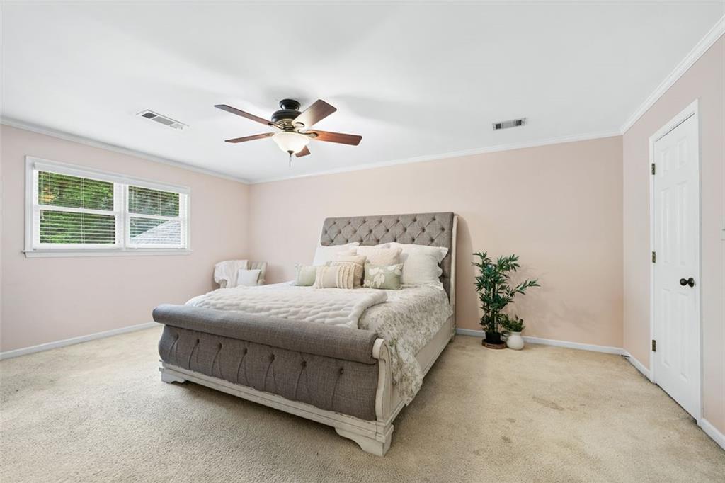 2065 Innsfail Drive Snellville, GA 30078 - Photo 33 of 67 a bedroom with a bed and window