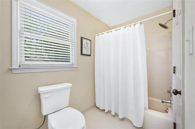 a view of a livingroom with a hardwood floor and a ceiling fan