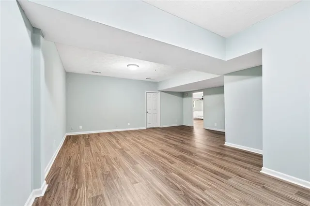 a living room with patio furniture and a floor to ceiling window