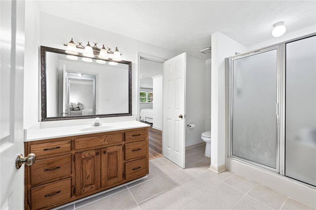 2065 Innsfail Drive Snellville, GA 30078 - Photo 46 of 71 a bathroom with a double vanity sink mirror and double