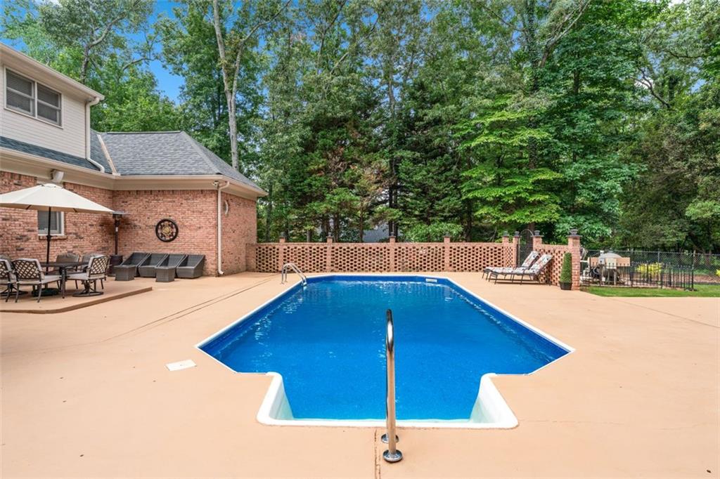 2065 Innsfail Drive Snellville, GA 30078 - Photo 52 of 67 a view of a swimming pool with a patio