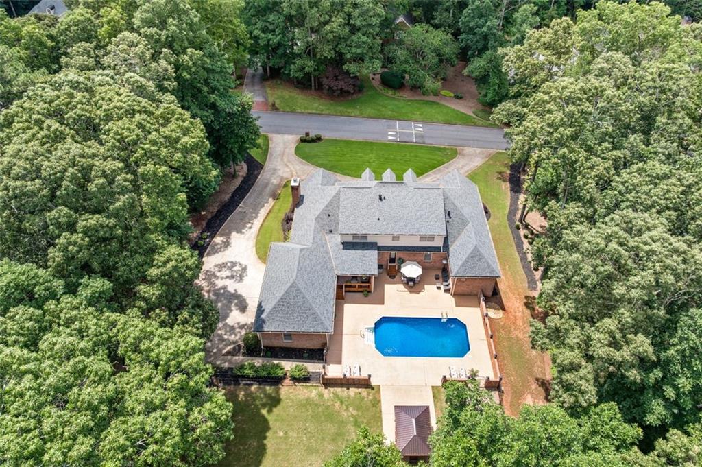 2065 Innsfail Drive Snellville, GA 30078 - Photo 61 of 67 an aerial view of house with swimming pool