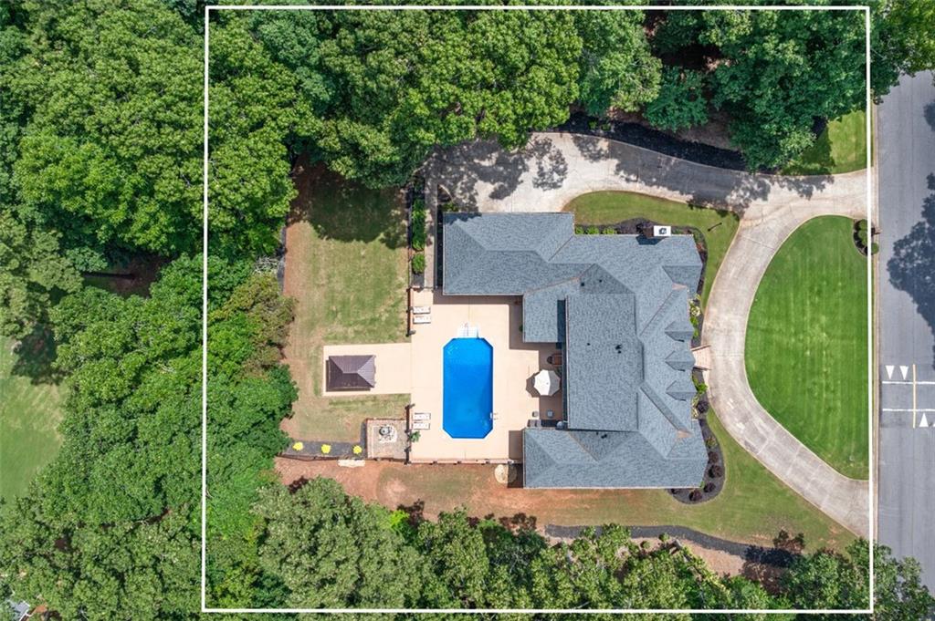 2065 Innsfail Drive Snellville, GA 30078 - Photo 62 of 67 an aerial view of a house with outdoor space and swimming pool