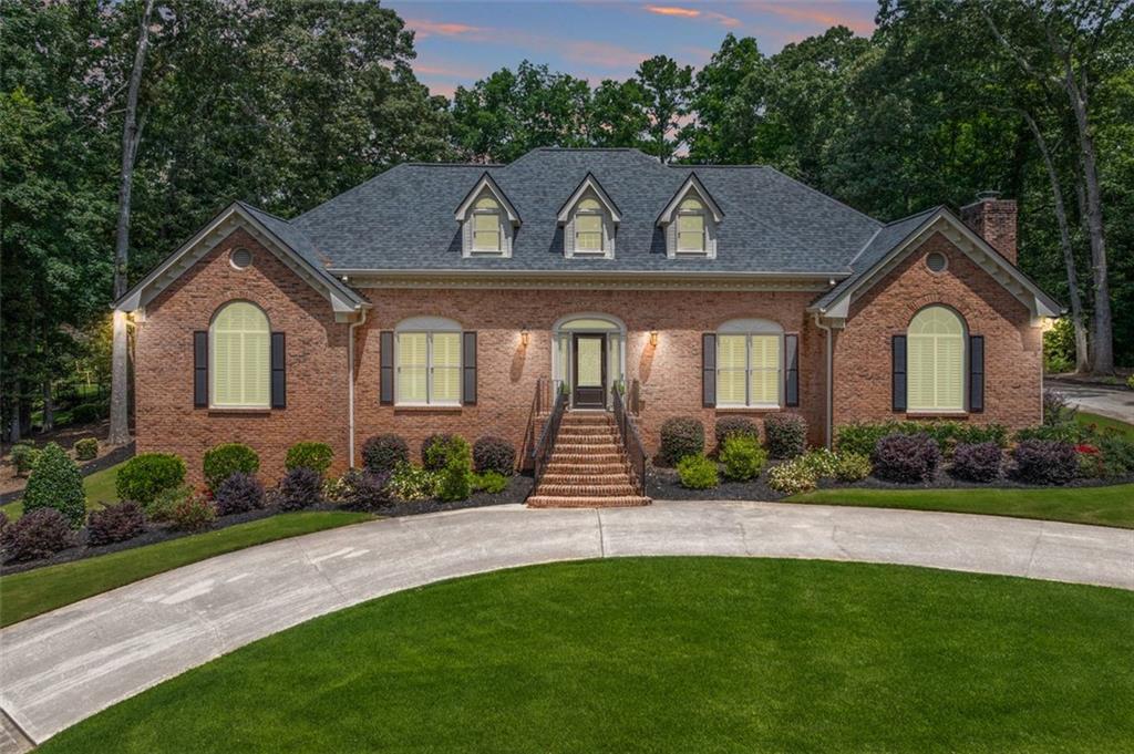 2065 Innsfail Drive Snellville, GA 30078 - Photo 66 of 71 a front view of a house with a garden