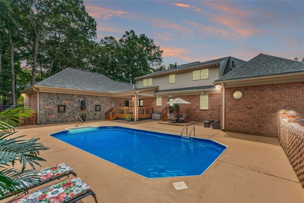 2065 Innsfail Drive Snellville, GA 30078 - Photo 67 of 71 a view of a house with swimming pool patio and a chairs