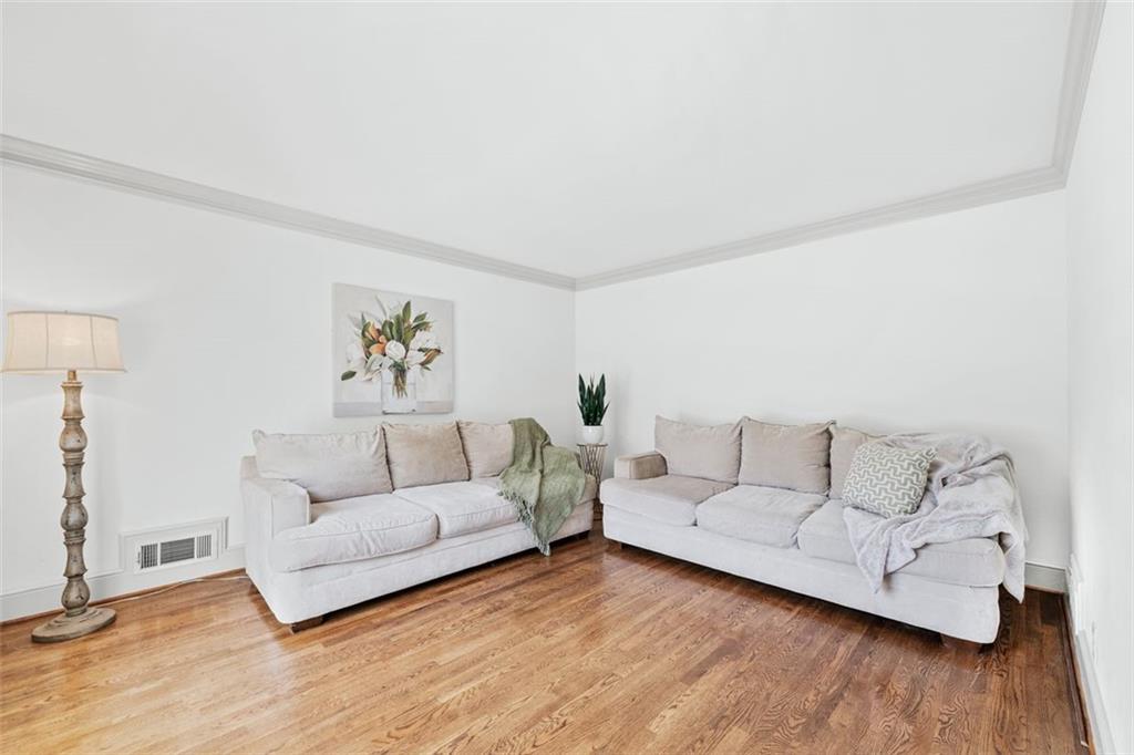 2065 Innsfail Drive Snellville, GA 30078 - Photo 8 of 71 a living room with furniture and wooden floor