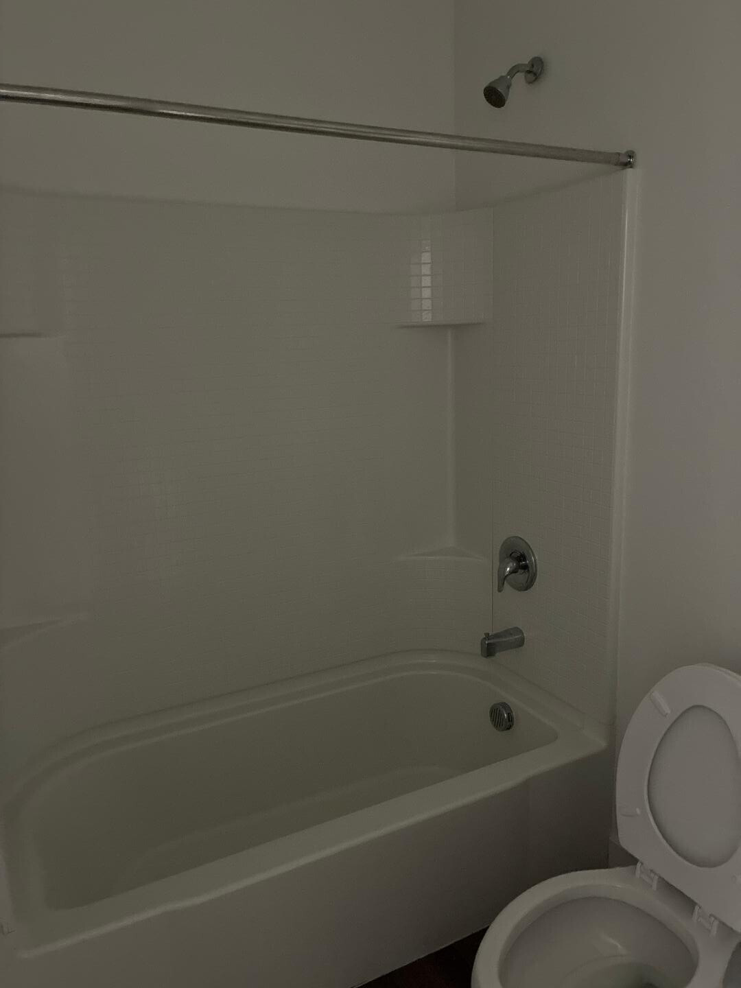 5630 South Daisy Patch Place Phoenix, AZ 85040 - Photo 8 of 14 a bathroom with a toilet and a bathtub