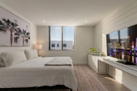 a room with a bed and a window