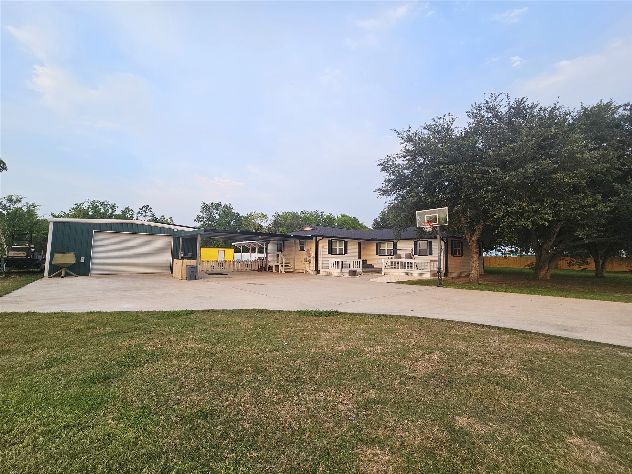 a front view of a house with a yard and a garage