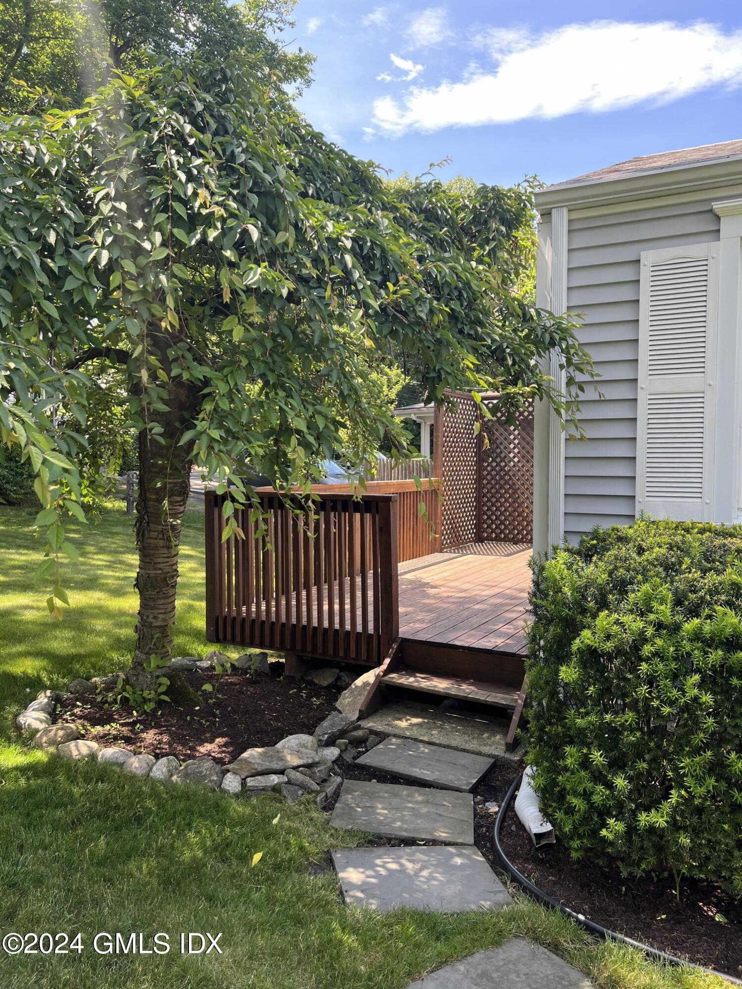 3 Silver Beech Road Riverside, CT 06878 - Photo 2 of 10 a view of a backyard with plants and large trees