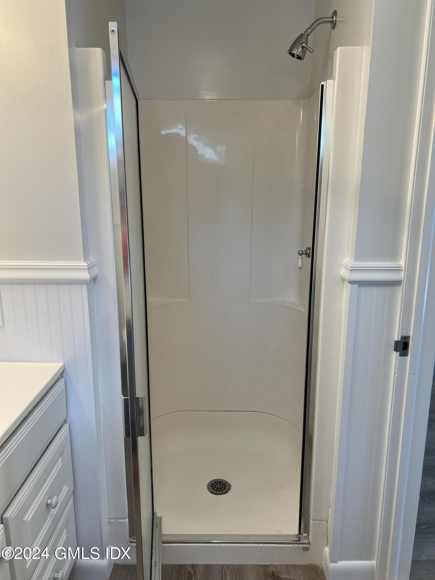 3 Silver Beech Road Riverside, CT 06878 - Photo 6 of 10 a bathroom with a glass door shower and a sink