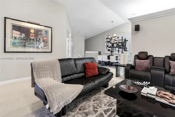 a living room with furniture and a rug