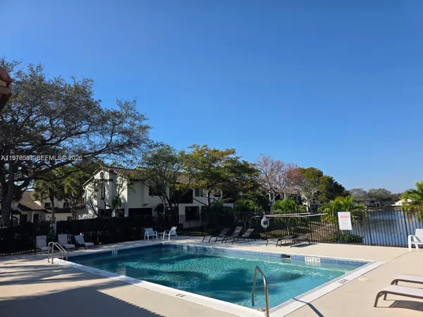 a view of a patio with swimming pool