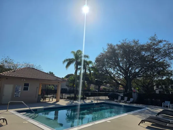 a view of a patio with swimming pool