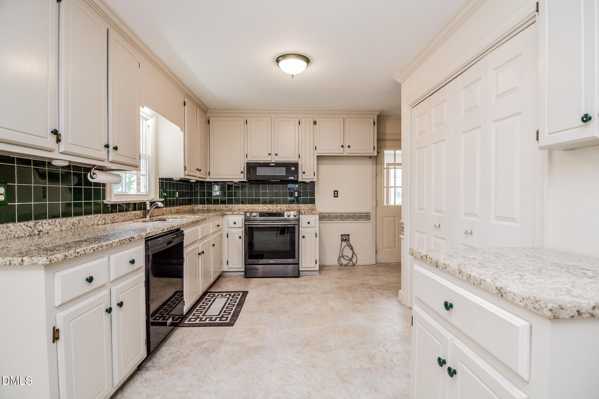 1215 Cambridge Road Northwest Wilson, NC 27896 - Photo 25 of 54 a kitchen with granite countertop white cabinets and white appliances