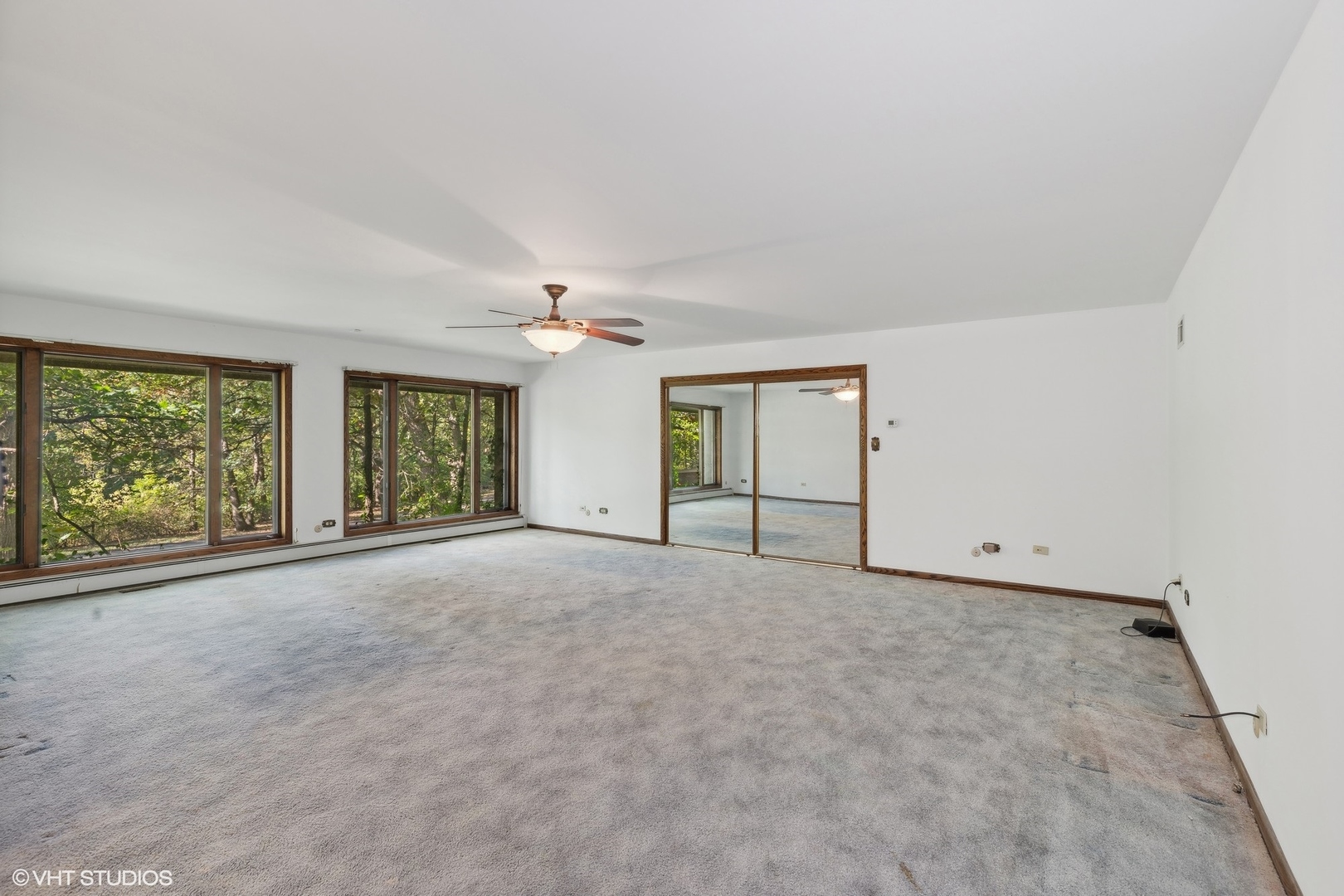 27721 South Klemme Road Crete, IL 60417 - Photo 13 of 28 a view of a big room with windows and chandelier fan