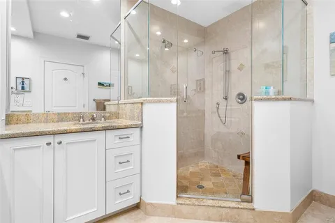 a kitchen with counter top space cabinets and window