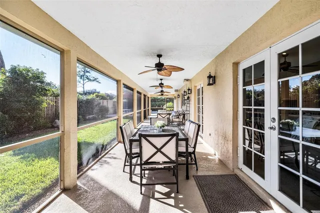 a view of a dining room with a table and chairs