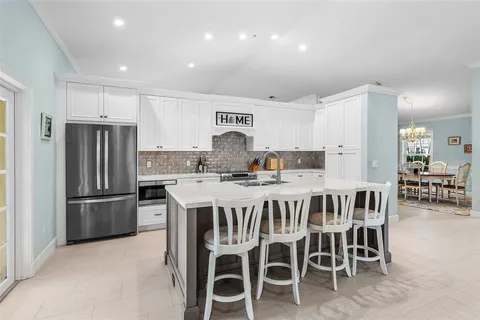 a living room with furniture gym equipment and a large window